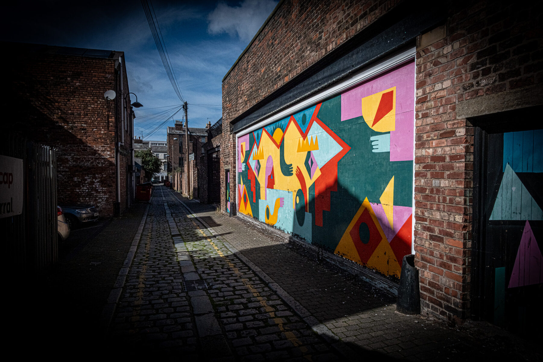 A bright mural in a Birkenhead back alley