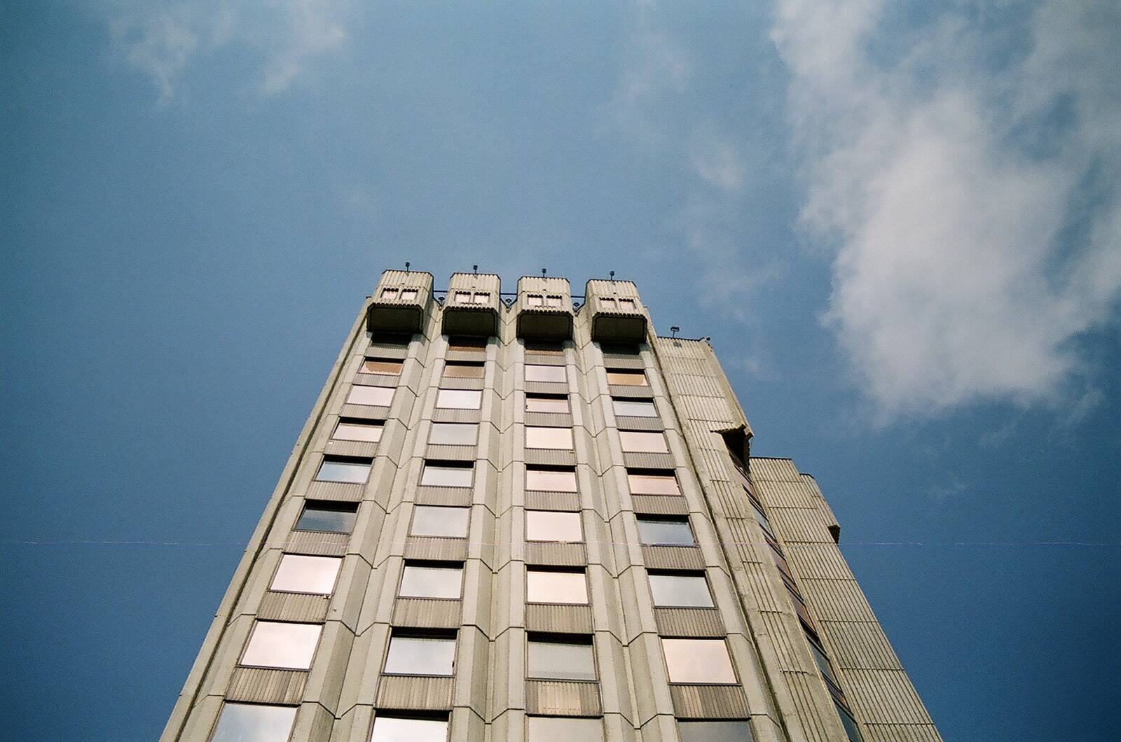 The crown — service floors worn like a general's cap.