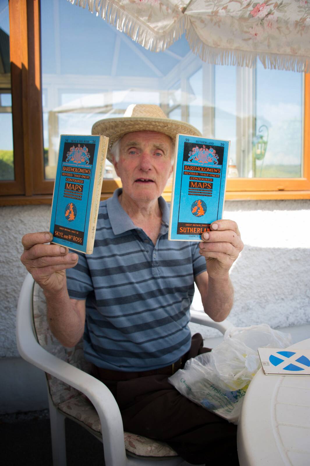 Bill holding up two copies of his book Jack's Lad