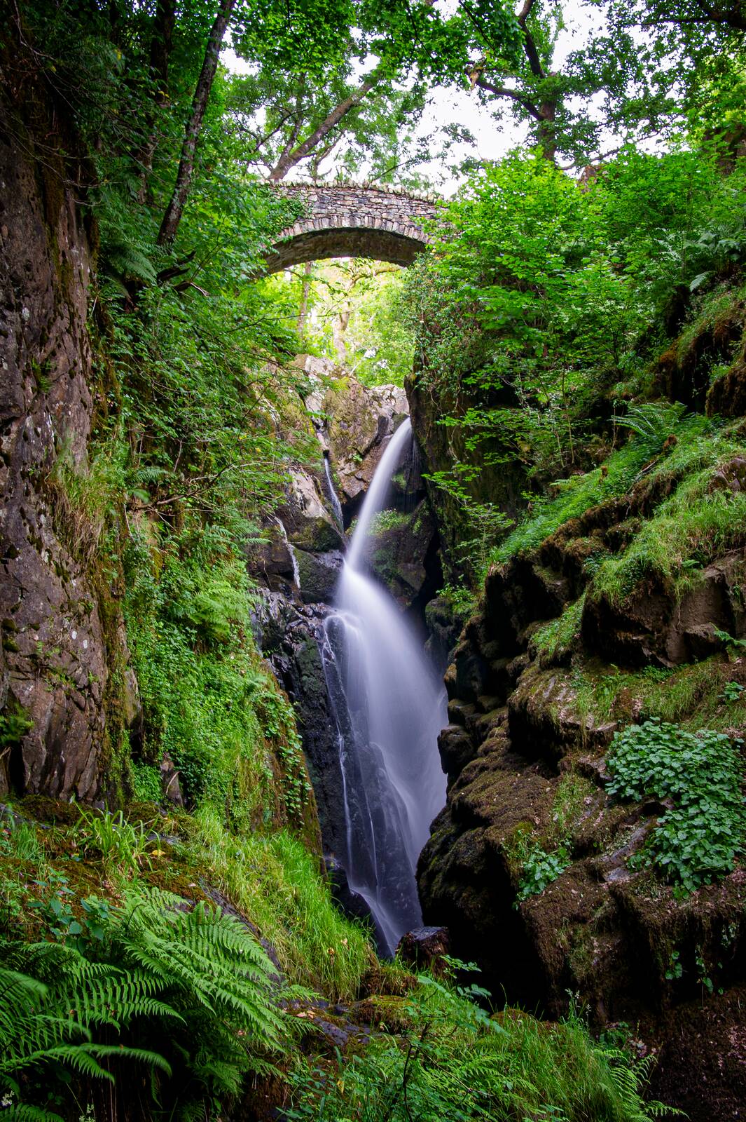 Aira Force waterfall under its stone bridge