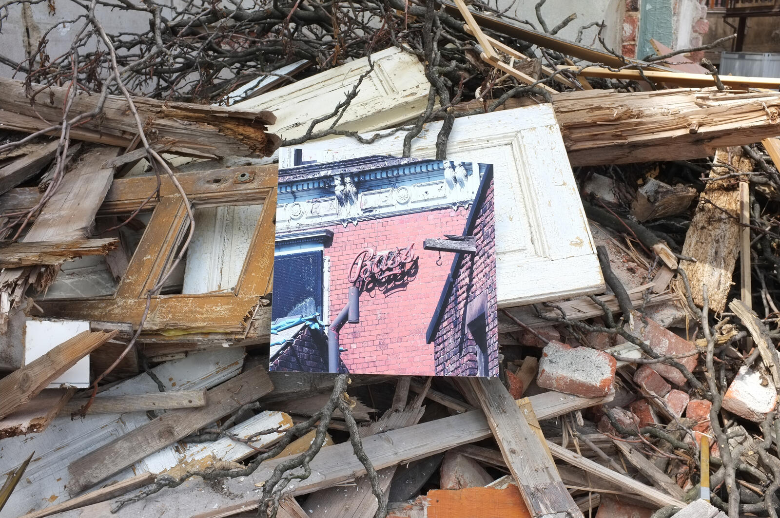 Print among demolition rubble and window frames