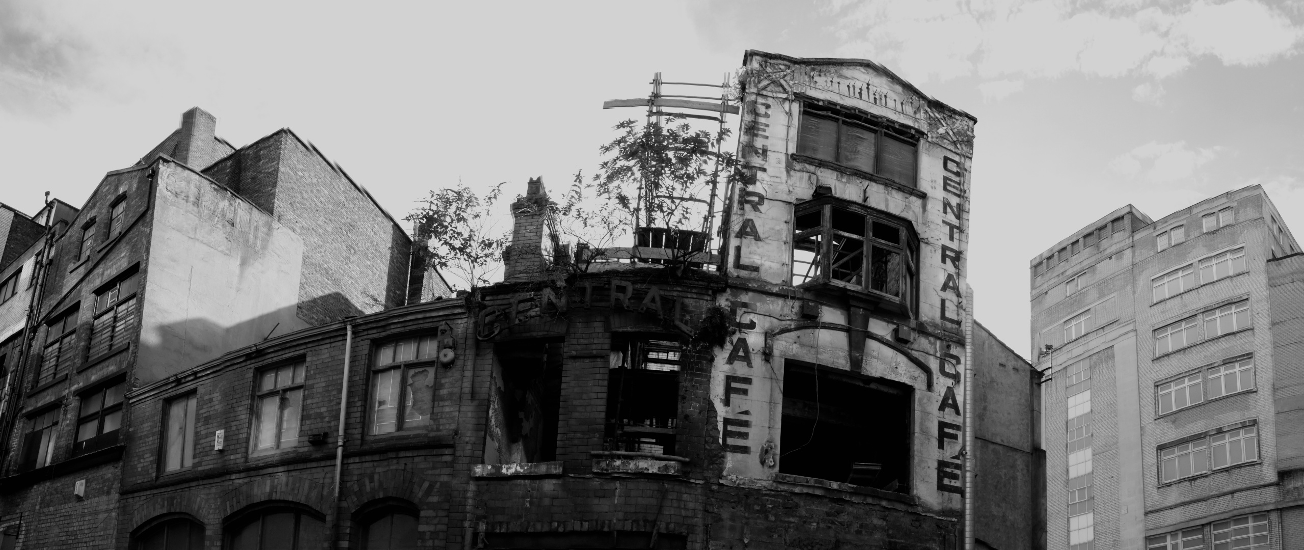 Panorama of a ruined pub block in black and white